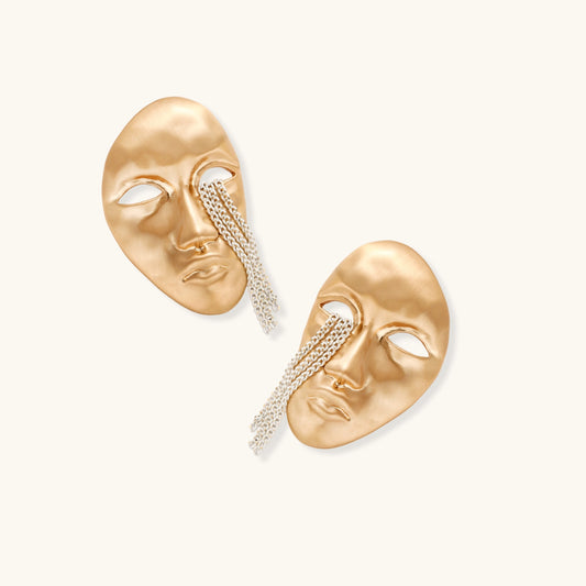 Sculptural face-shaped earrings with flowing chain tassels in polished eco-zinc alloy with sterling silver posts