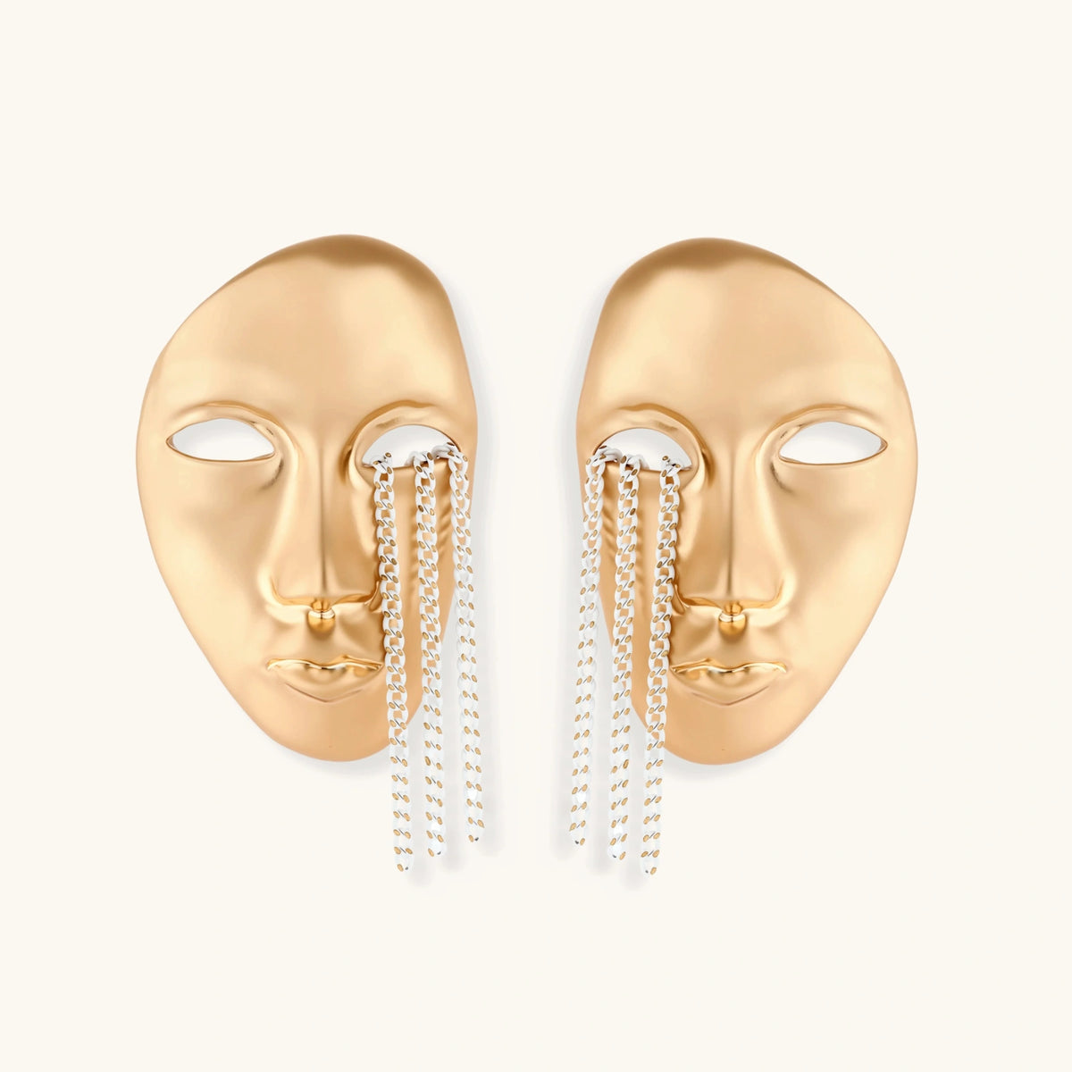 Sculptural face-shaped earrings with flowing chain tassels in polished eco-zinc alloy with sterling silver posts
