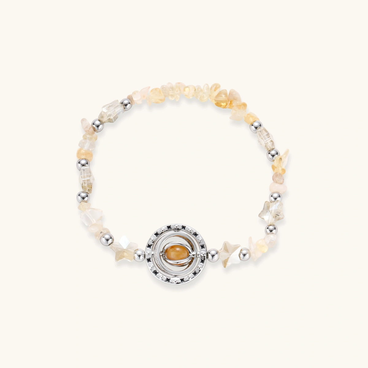 Stretchable bracelet with cream citrine stone chips, brass beads, and central amber zirconia pendant on neutral background.